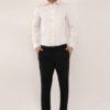Full-body view of a model in a light pink Giza cotton shirt by Crownberry, paired with black formal pant for a chic, relaxed look.