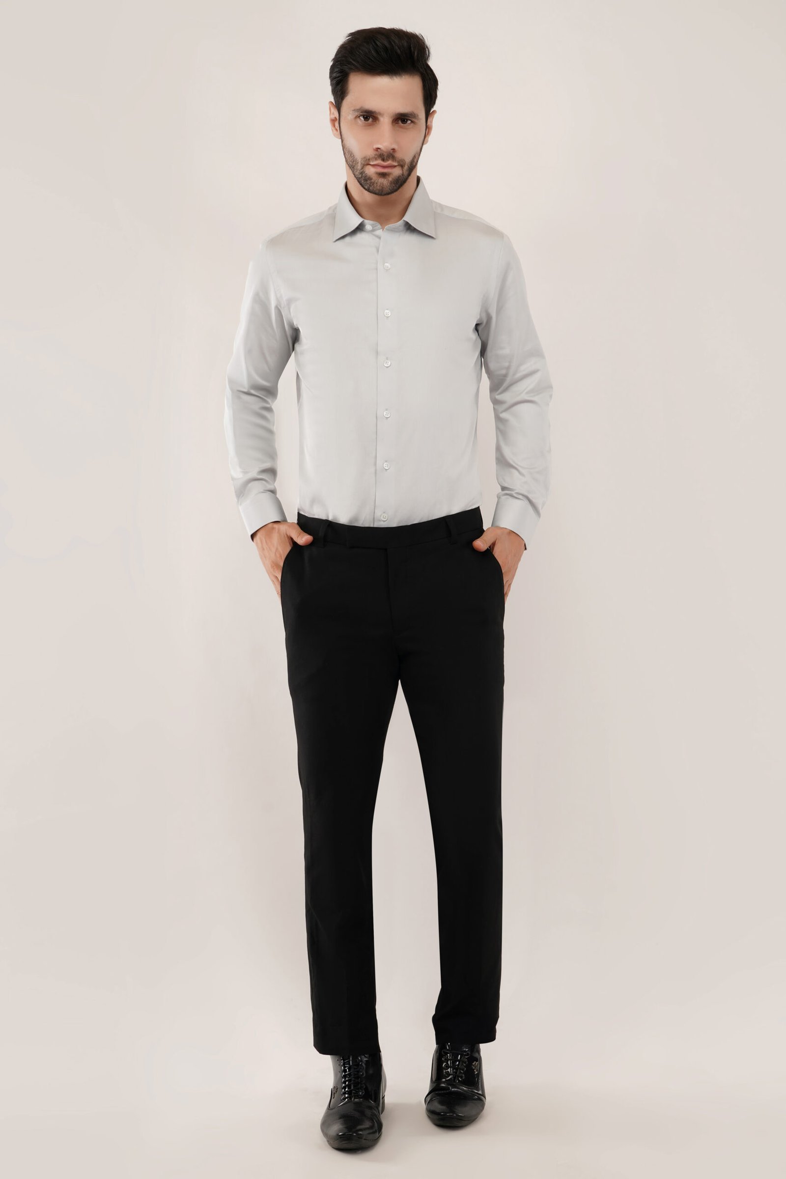 Model wearing a grey shirt for men, showcasing classic fit and sleek style.