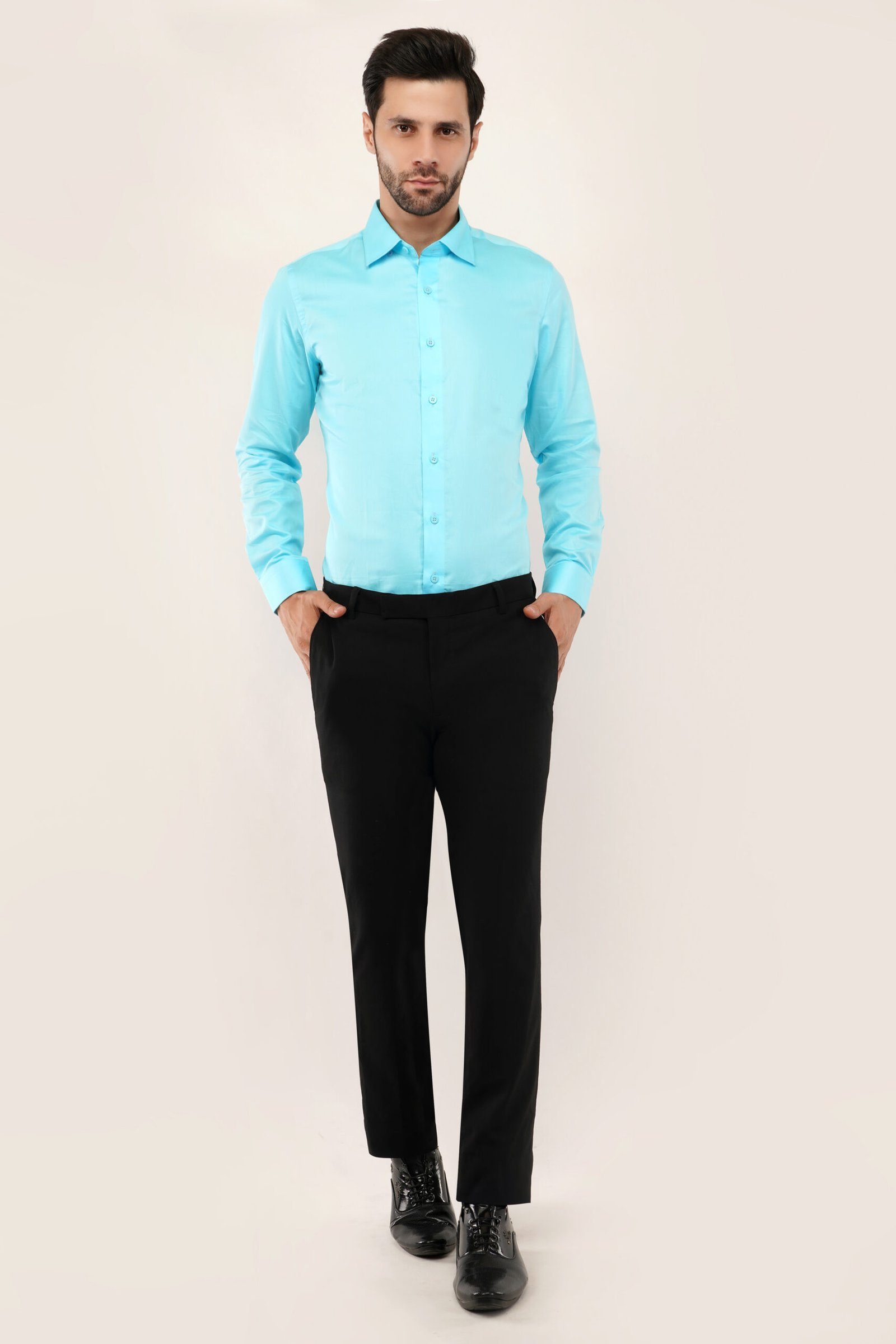 Model wearing light blue shirt for men, showcasing modern fit and stylish design