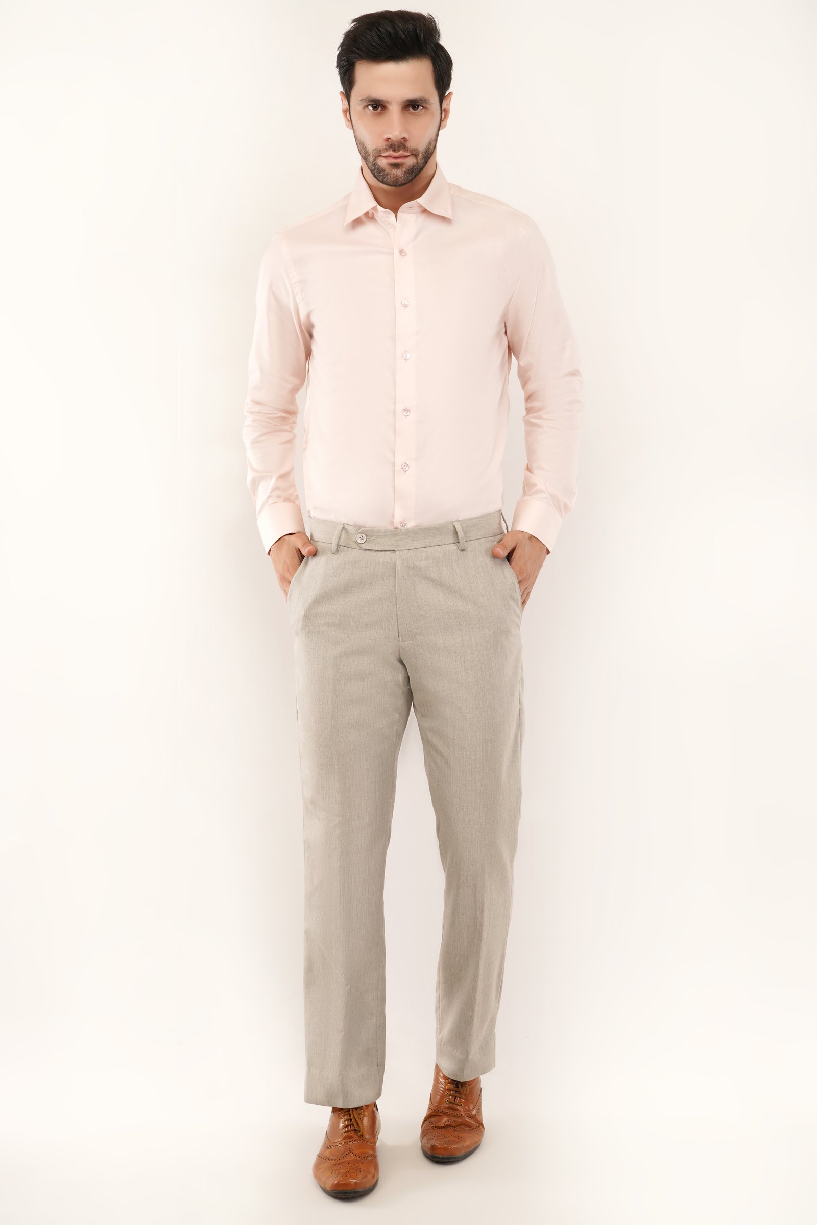 Model wearing a stylish peach color shirt, showcasing its comfortable fit and premium cotton fabric for men.