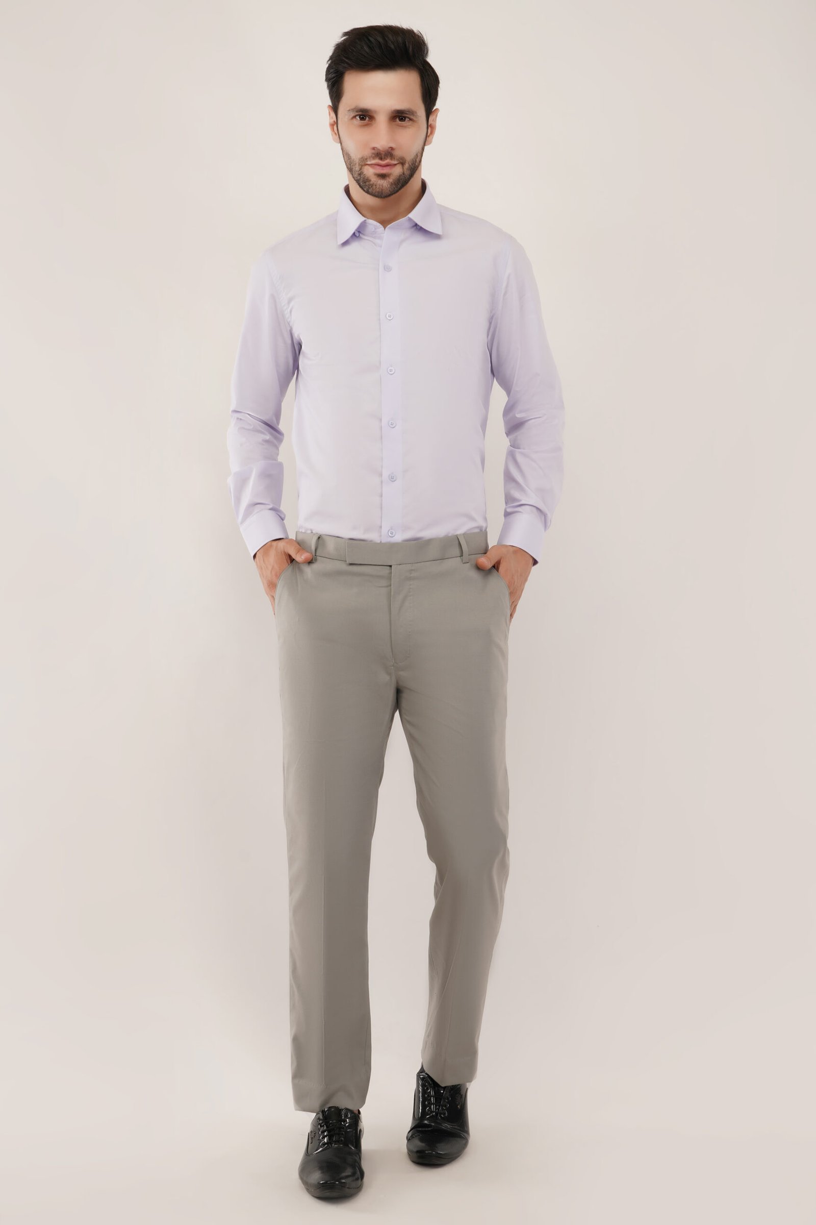 Model showcasing a lavender shirt, featuring a modern design and premium cotton fabric for men's fashion.