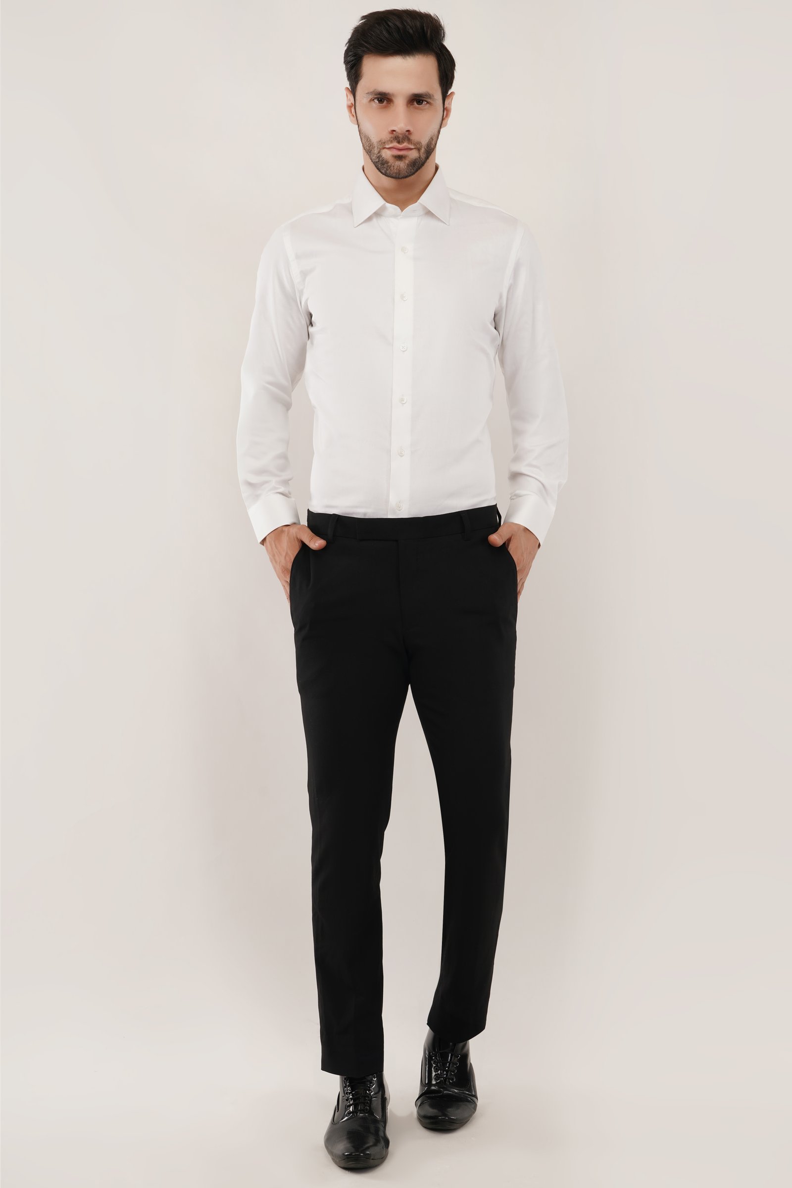 Model wearing a classic mens white shirt, showcasing premium cotton fabric and tailored fit.