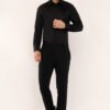Model wearing a sleek black shirt, showcasing a modern fit and premium cotton fabric for men.