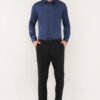 Model showcasing a navy blue shirt, highlighting its stylish design and perfect fit for modern men.