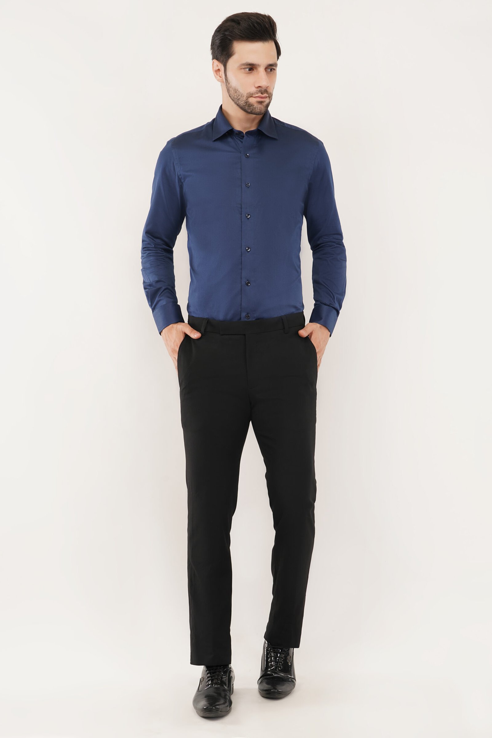 Model showcasing a navy blue shirt, highlighting its stylish design and perfect fit for modern men.